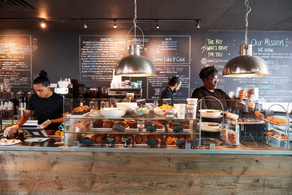 Business security staff working at a busy cafe