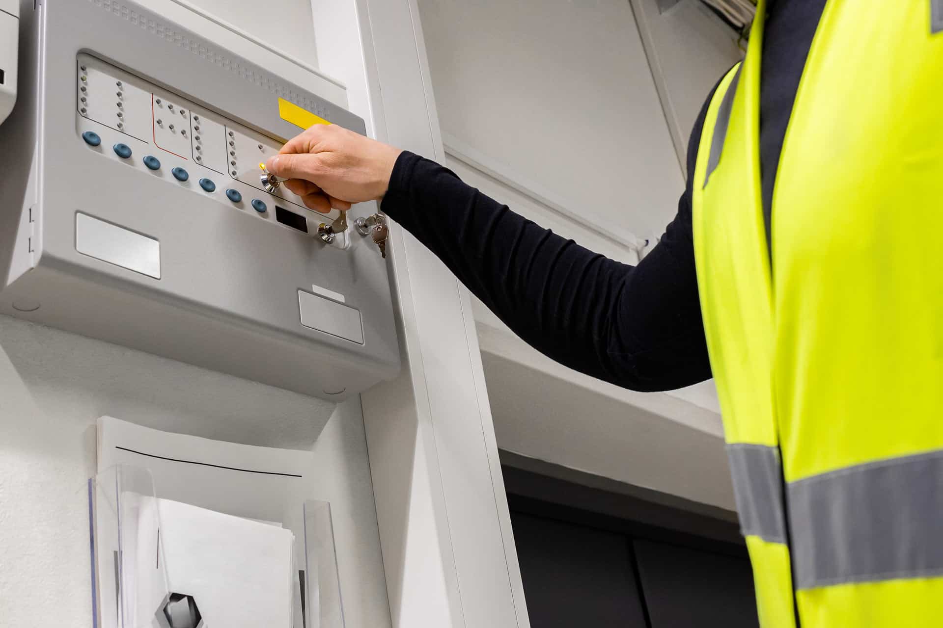 Fire and Life Safety Director operating a fire alarm system