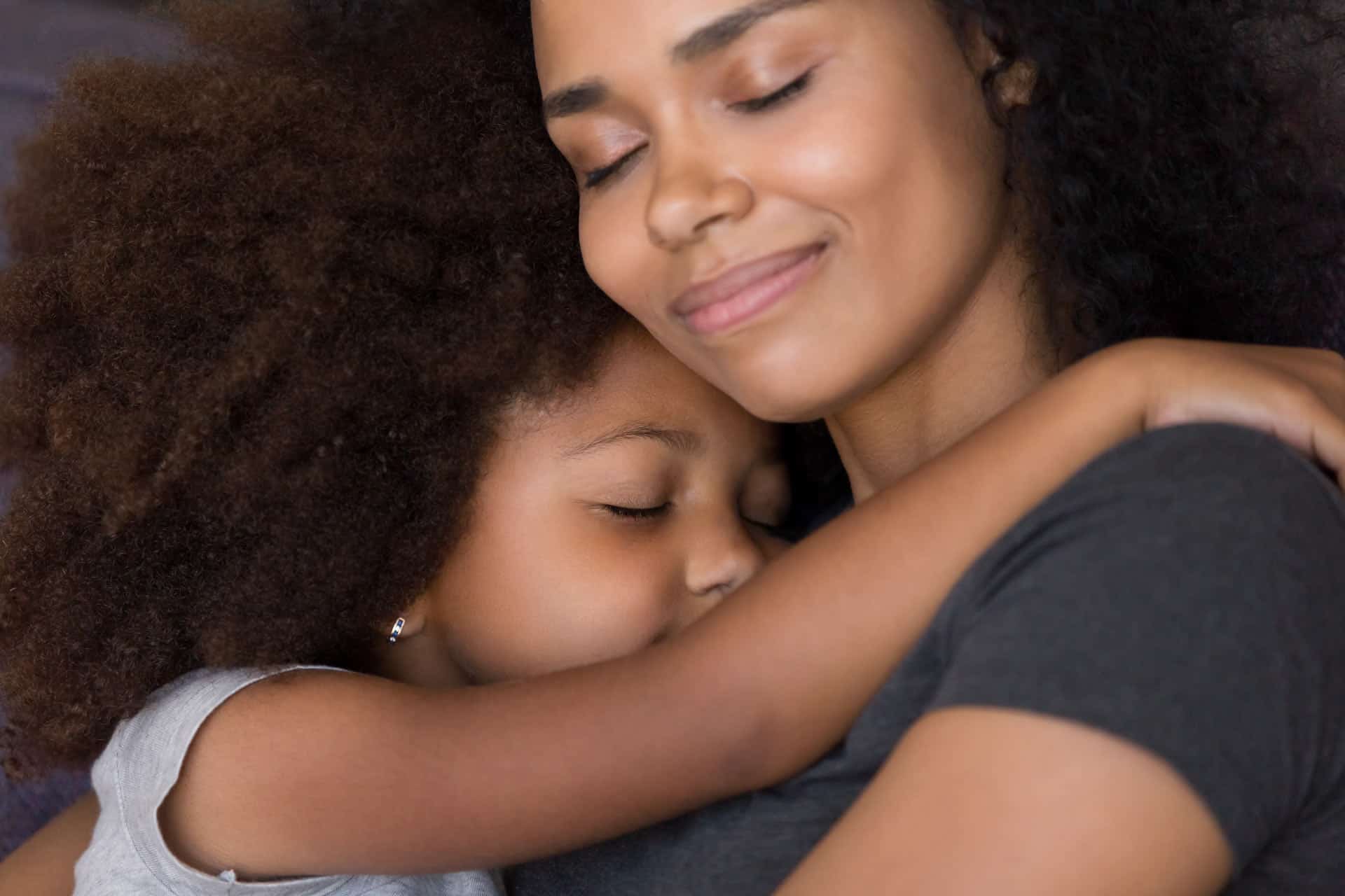 Mother hugging her daughter