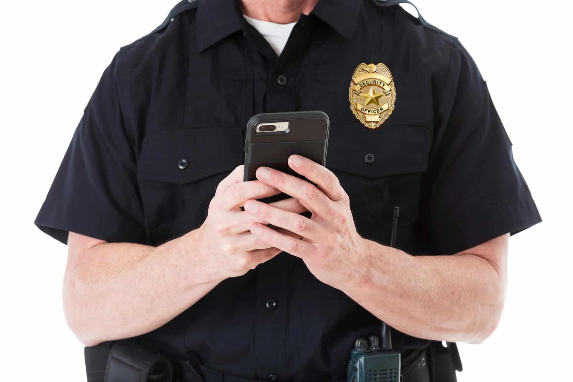 Security guard using mobile device to report