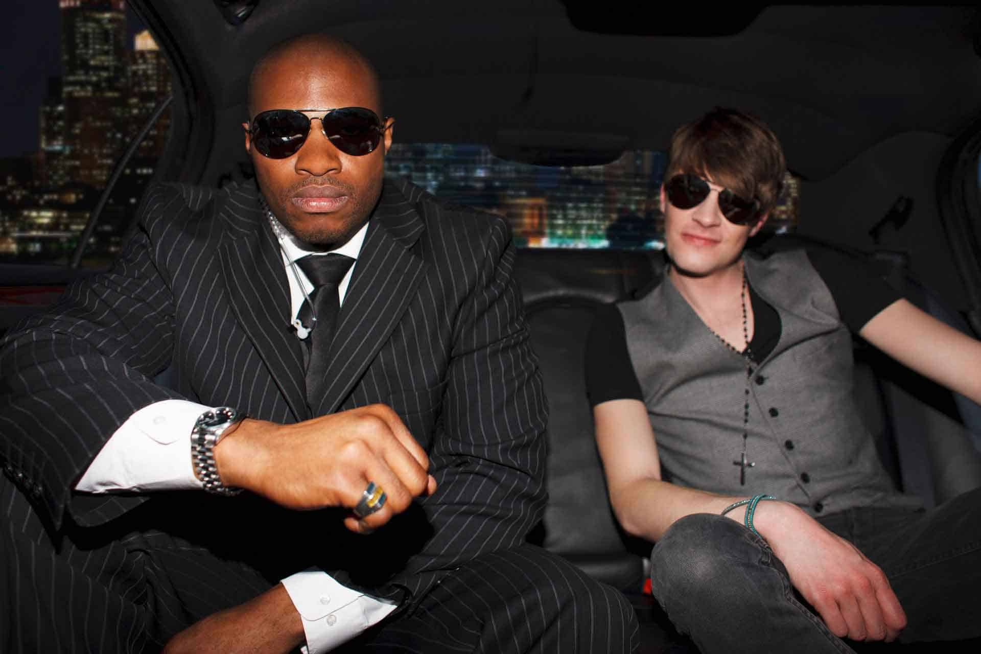 Celebrity and bodyguard in a limo