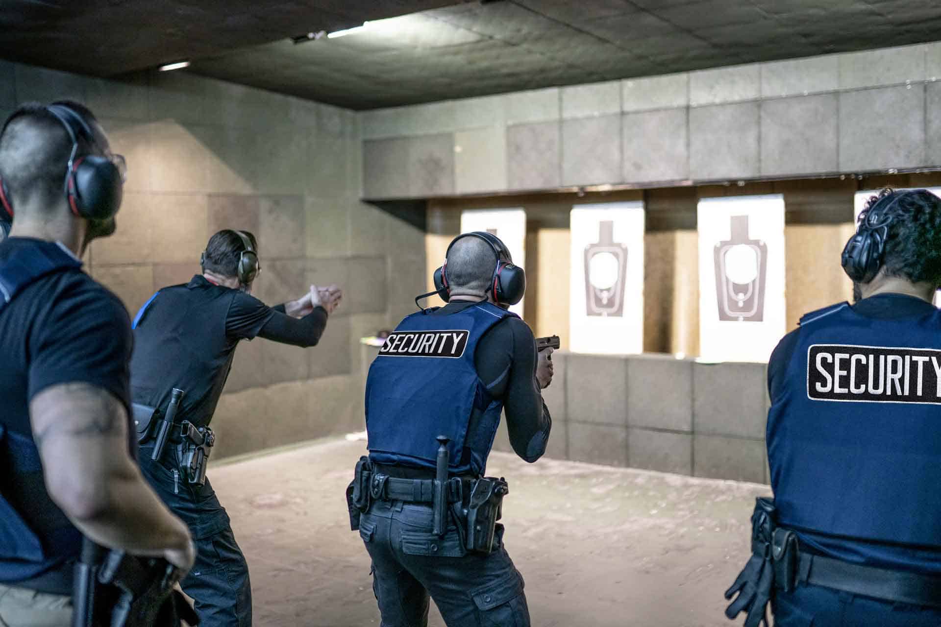 Armed security guards at a shooting practice