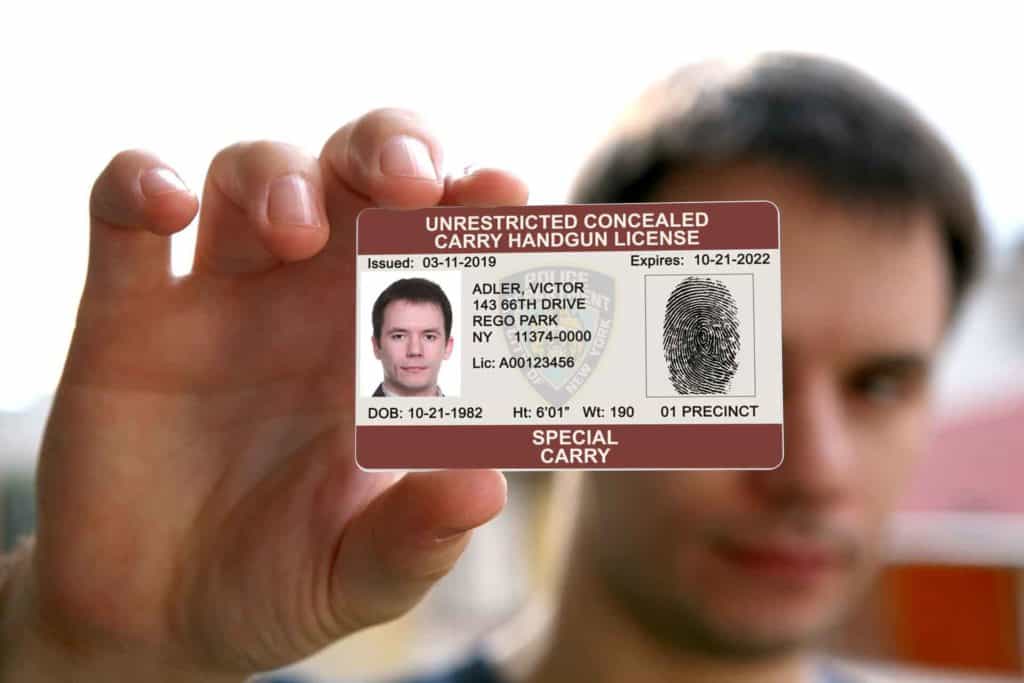 A man is holding his armed security license